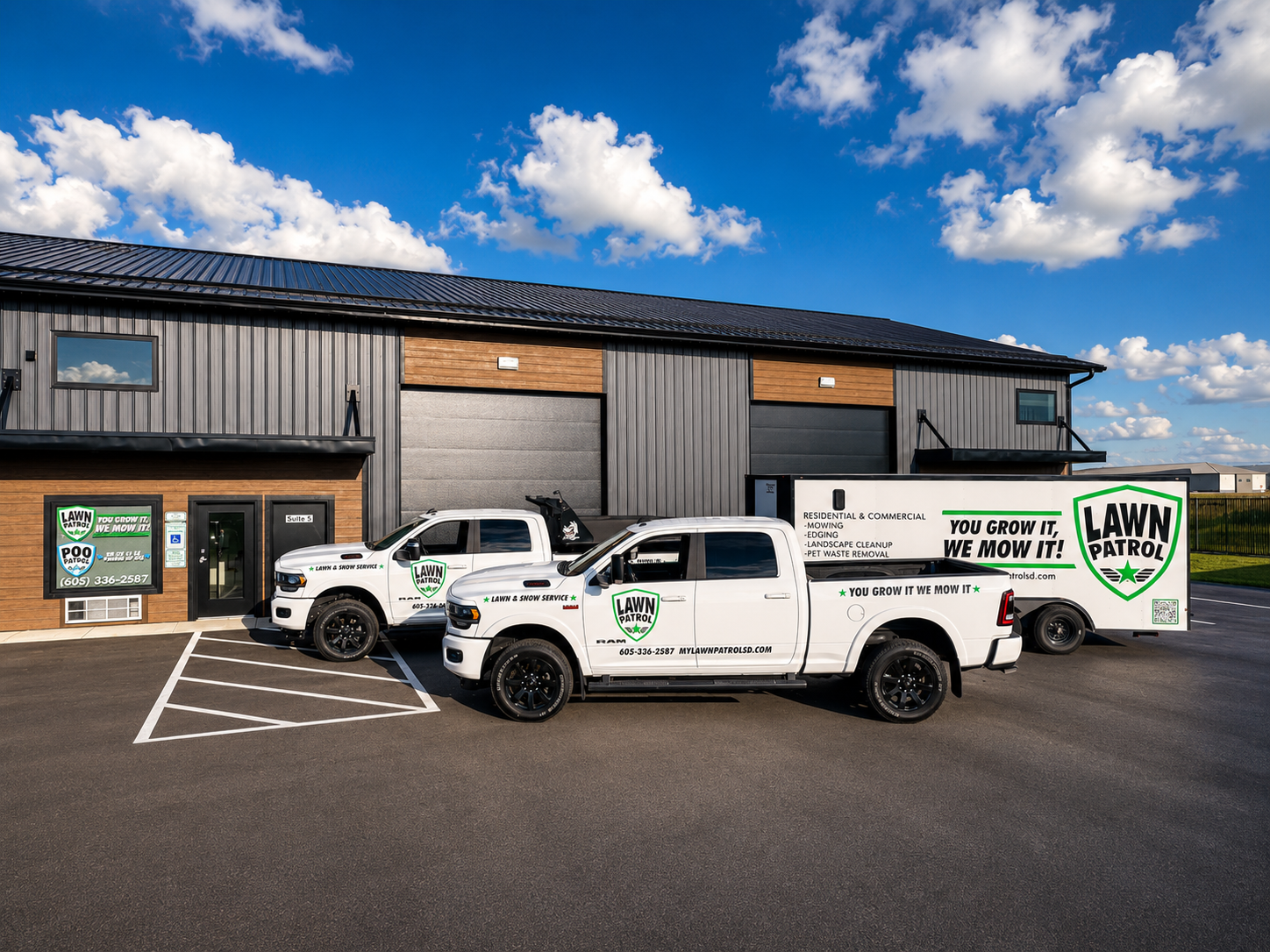 Lawn-Patrol trucks and trailer parked outside the Tea, SD shop